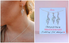 bridesmaid wearing crystal leaf earrings