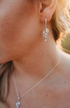 Bridesmaid wearing silver leaf earrings and necklace set