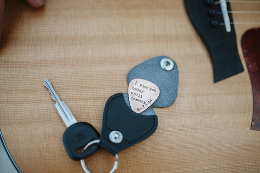 Custom copper guitar pick with leather holder